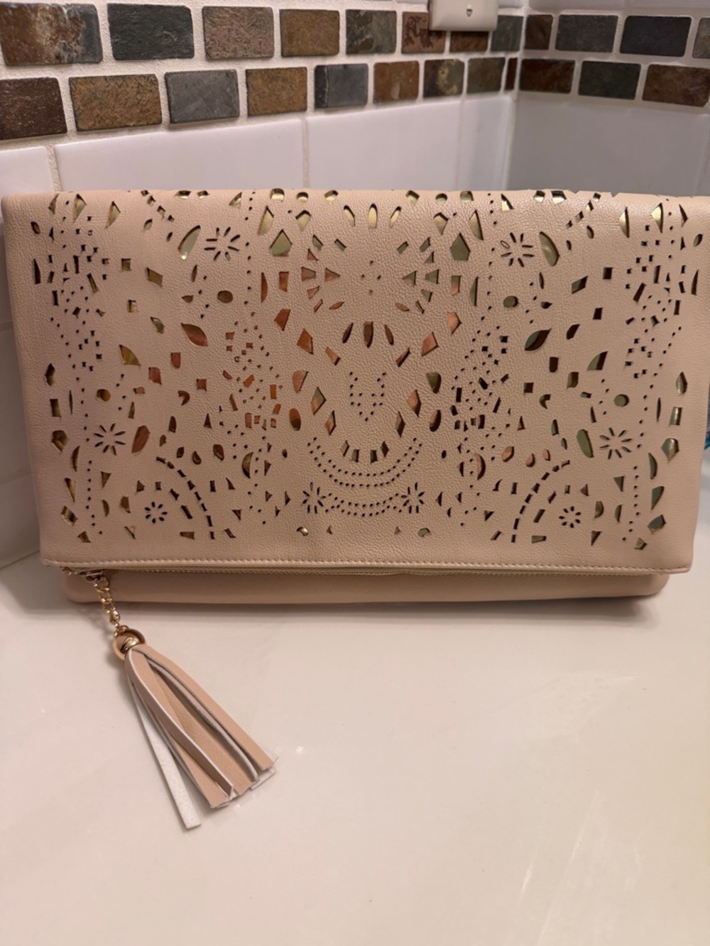 Beige Laser-Cut Tassel Clutch Bag